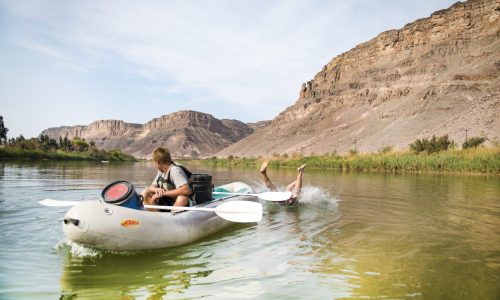 Man falling behind canoe on Orange River paddle