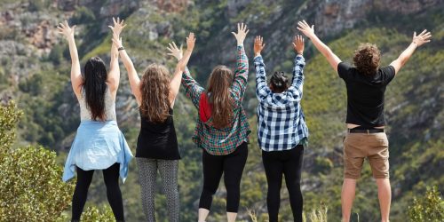 Rearview shot of a group of friends having fun together on a roadtrip.