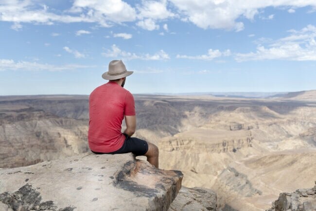 Traveler looking over Fish River Canyon
