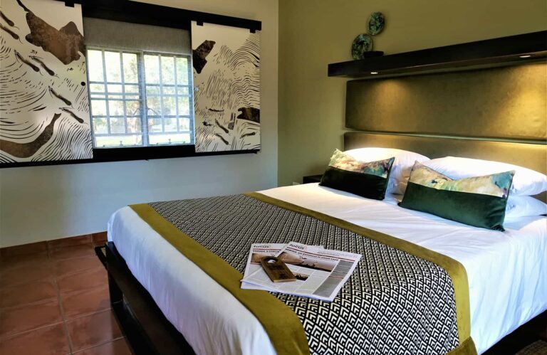bedroom with a double bed and a newspaper
