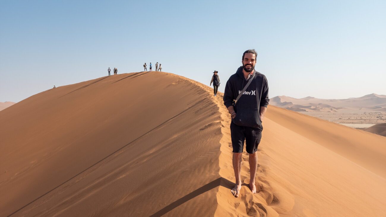 male walking on big daddy dune