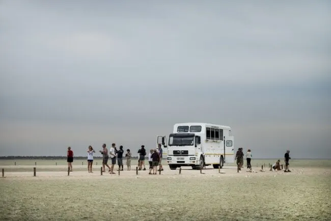 Overland vehicle parked for camp set up in Etosha Pan