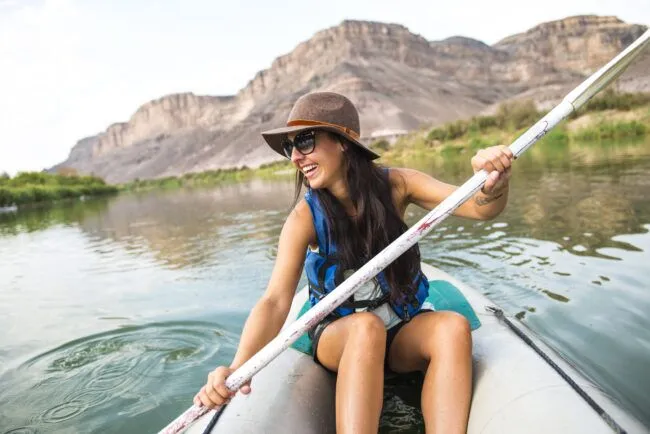 Happy traveler canoeing in Orange River