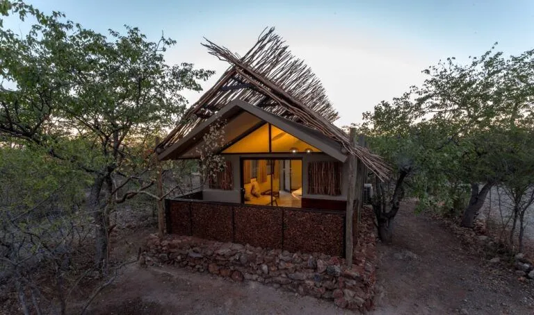 Exterior of a rustic room at Etosha Village