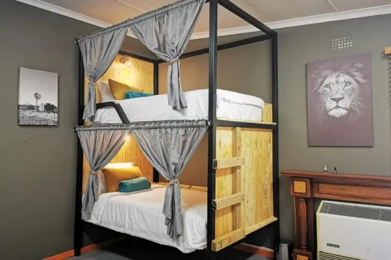 inside of a room with bunk beds and a radiator