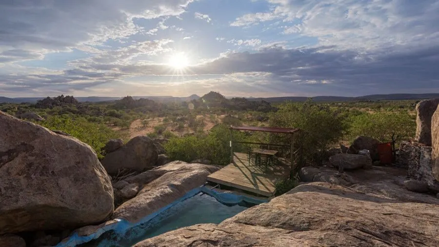 campsite with a view of a swimming pool and the landscape