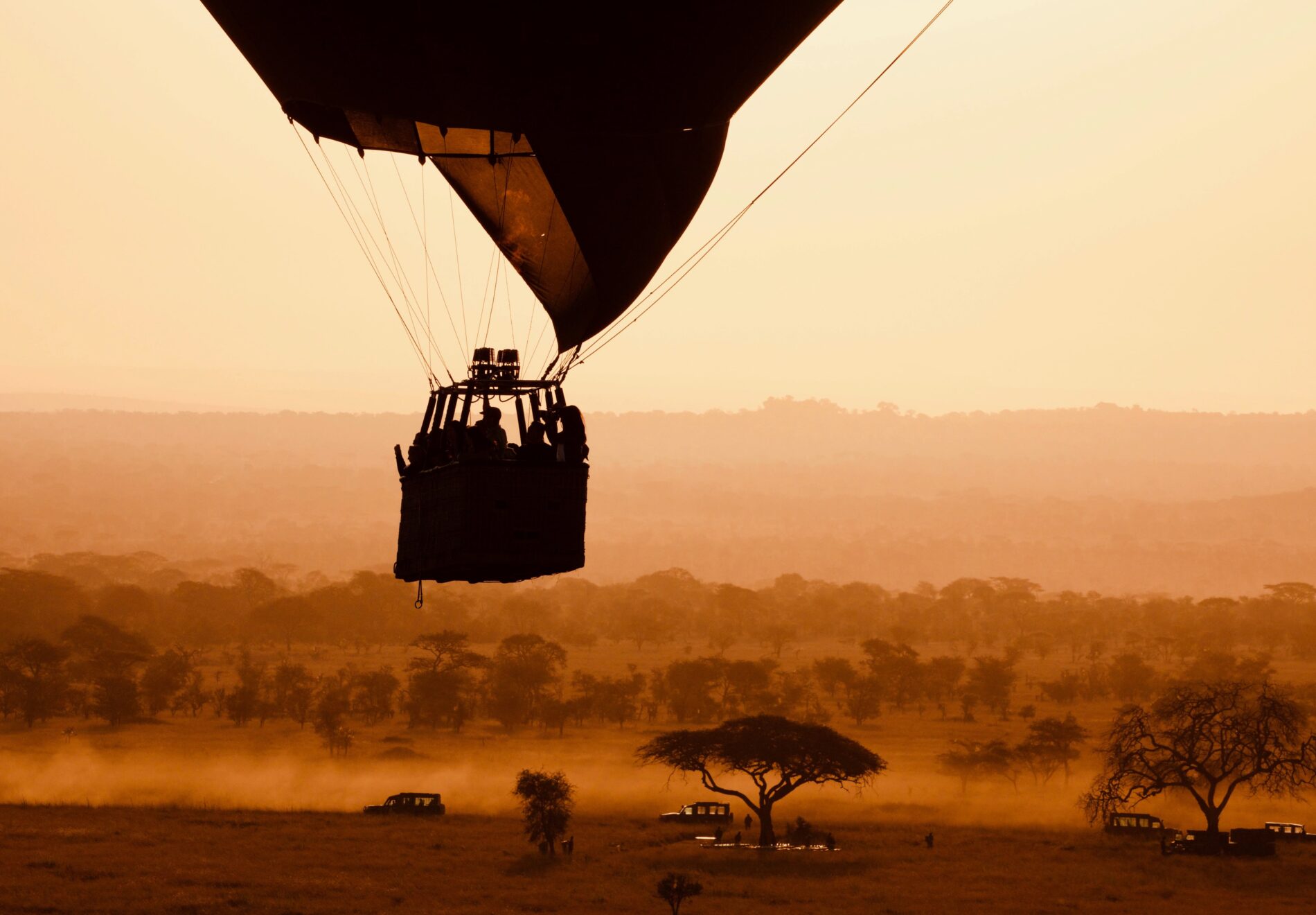 Hot air balloon launching over Serengeti plains
