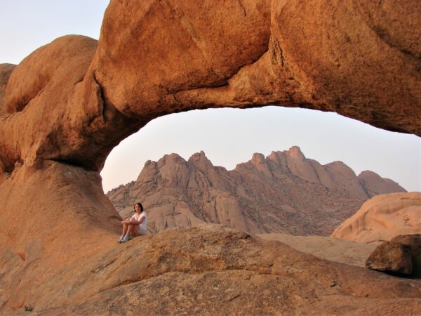 Sossusvlei Eye in the Namib Desert with lone traveler