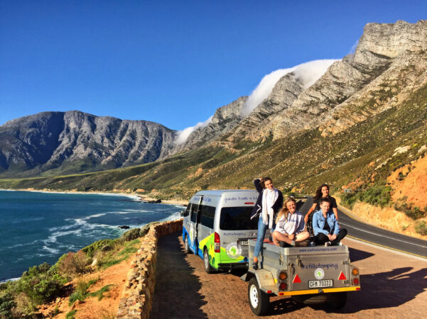 Travelers posing on Chapmans Peak Drive