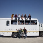 Group pic on top, inside & in front of overland vehicle in Nata Pans