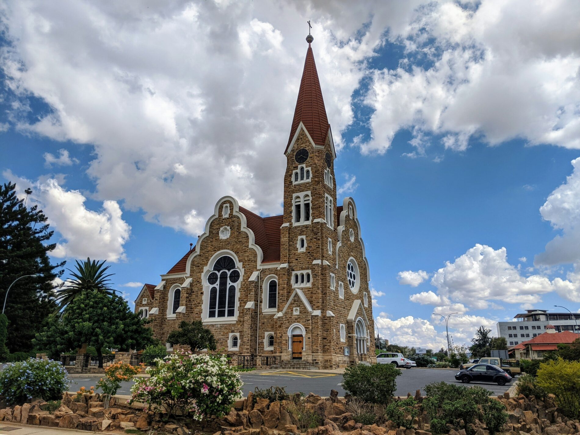 wide angle of a church with clouds in the background