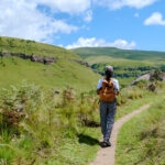 Woman on a hiking trip in the mountains, Drakensberg Mountain South Africa, Central Drakensberg Kwazulu Natal