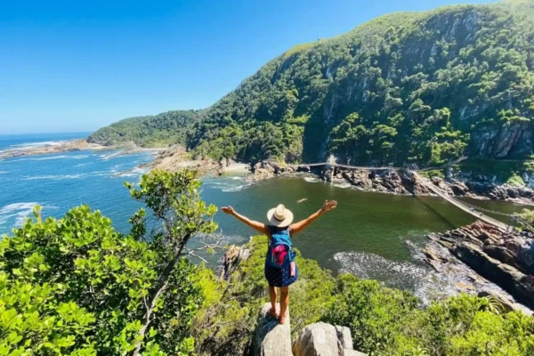 Tsitsikamma traveler stands at storms river bridge