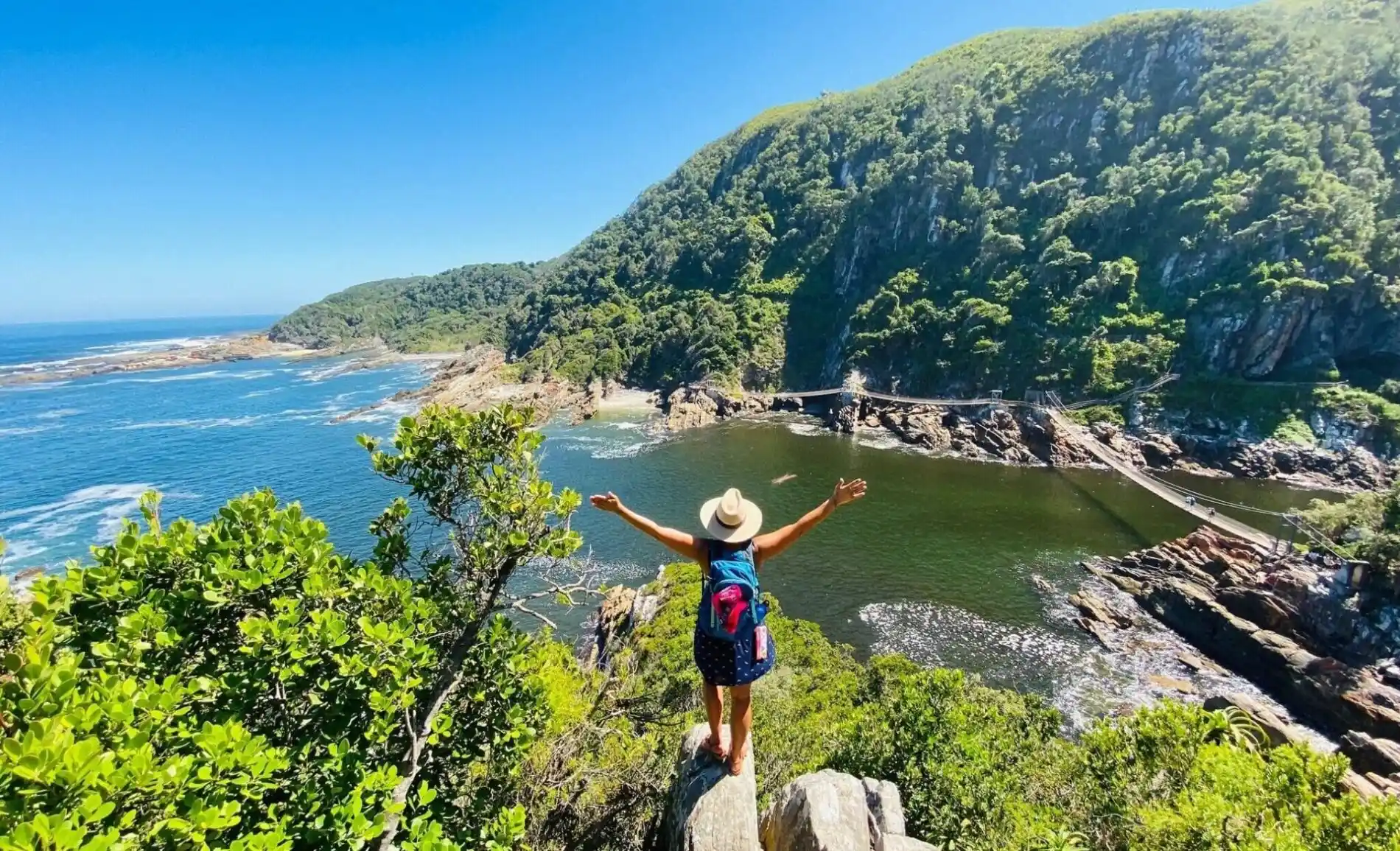Tsitsikamma traveler stands at storms river bridge