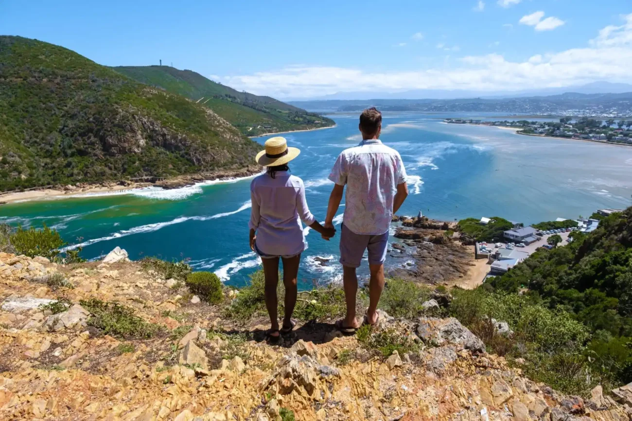 A couple on a road trip at the garden route in South Africa, overlooking view from Knysna Heads viewpoint