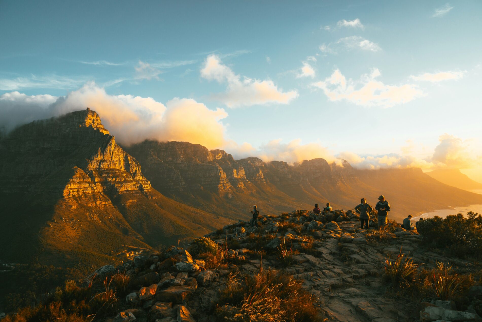 stunning view of a group of tourists admiring table mountain during sunset