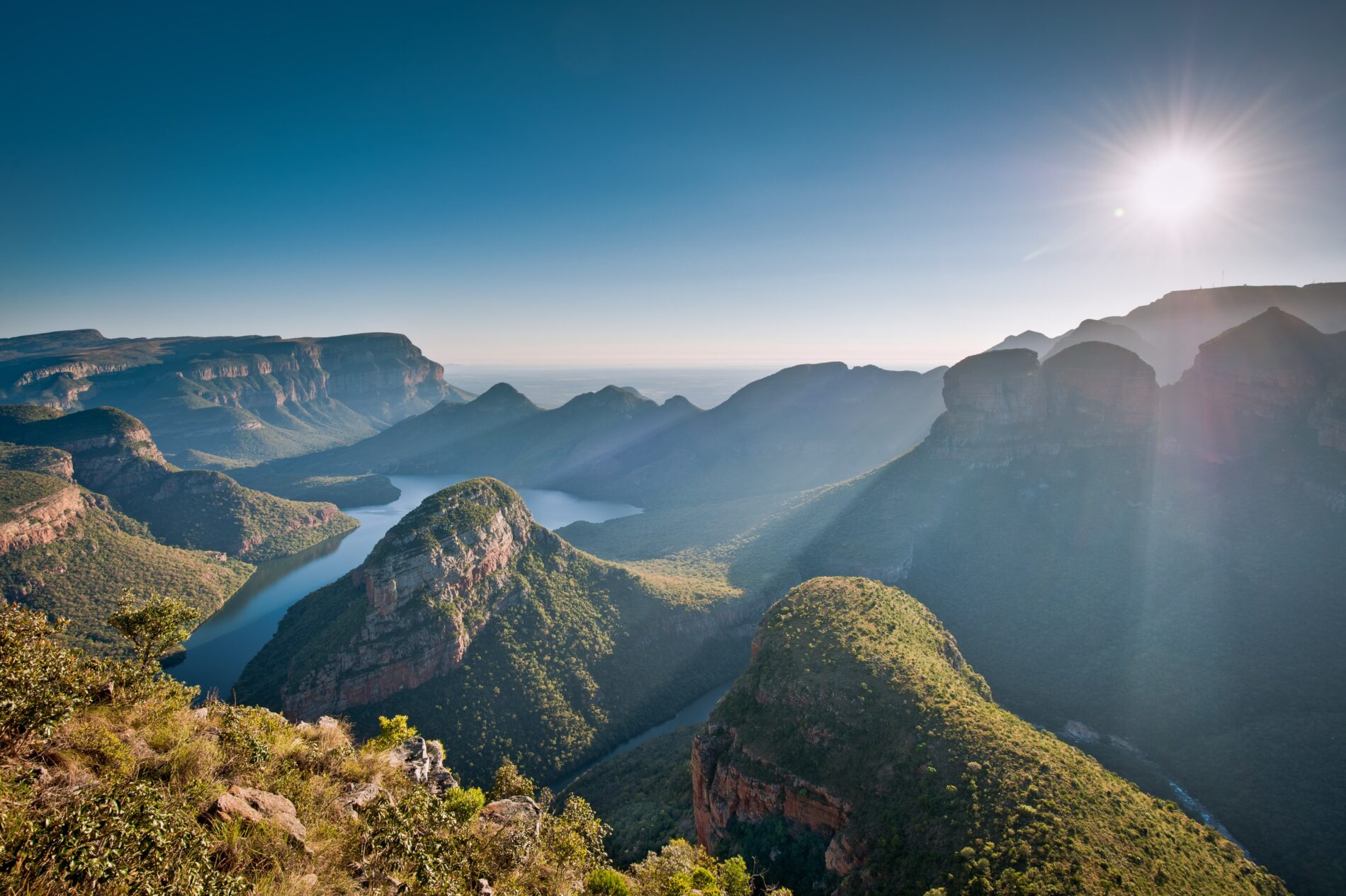 Sun sets behind breathtaking Blyde River Canyon landscape.