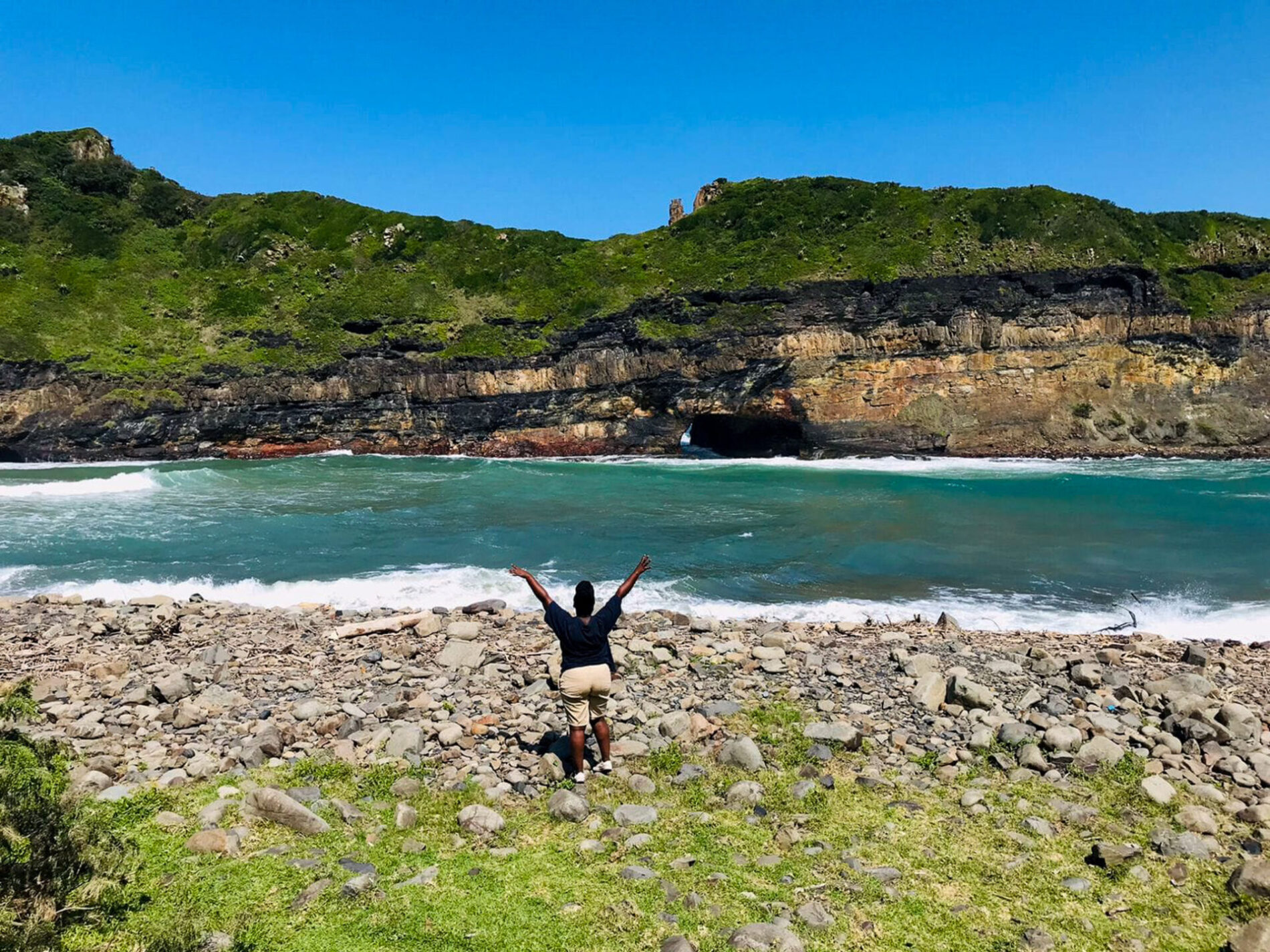 a person posing in front of a bay