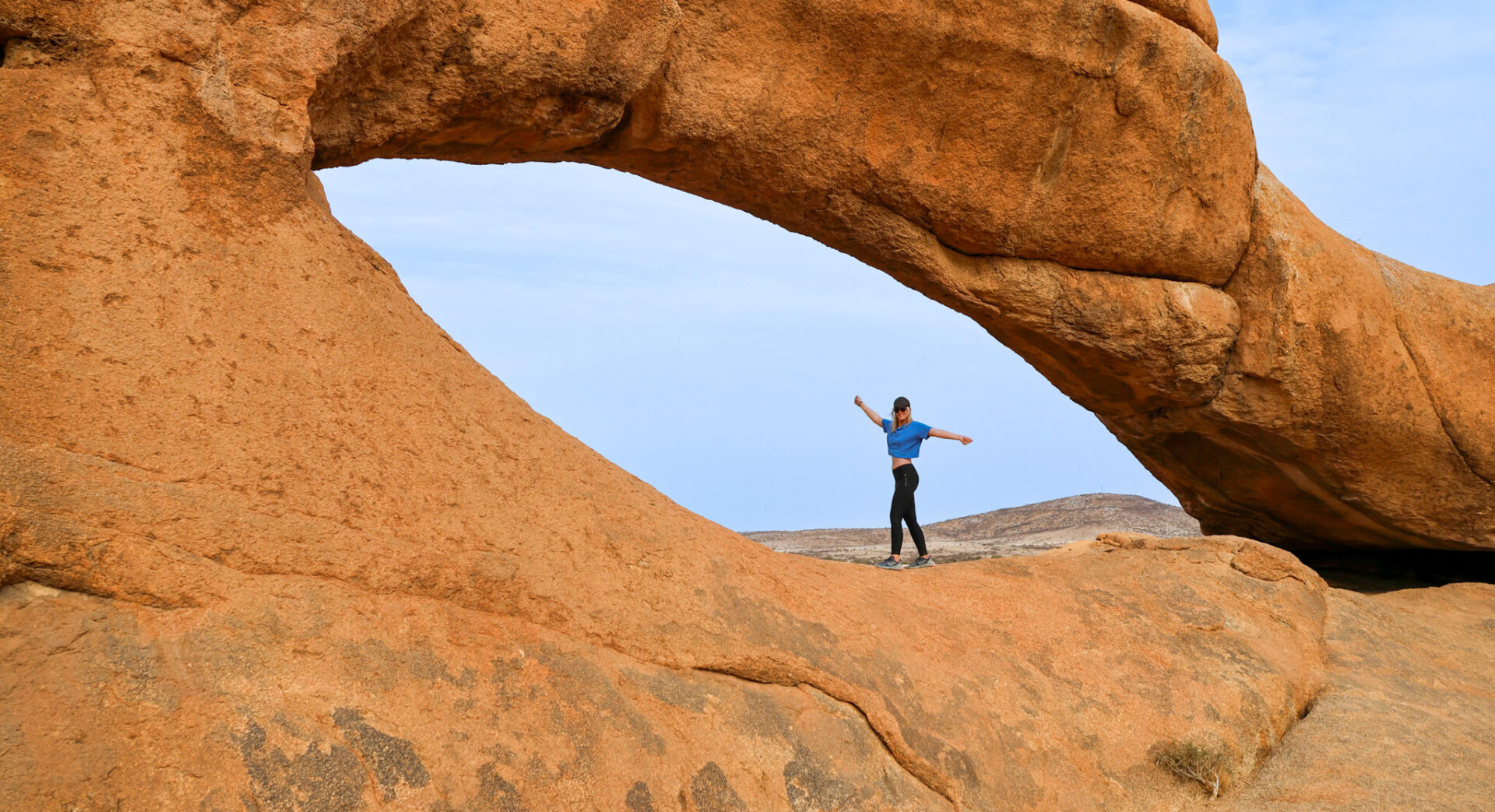 female posing in the eye at spitzkoppe