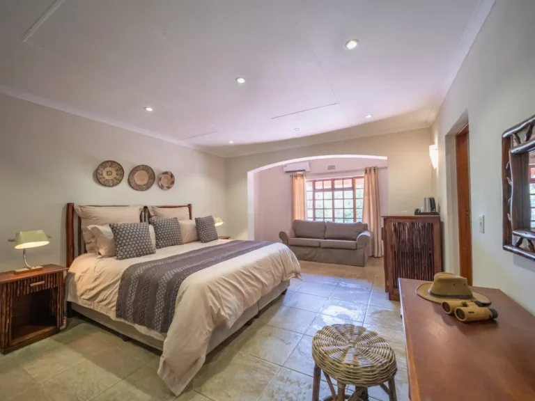 Luxurious interior bedroom of manor house accommodation at Kruger Lodge