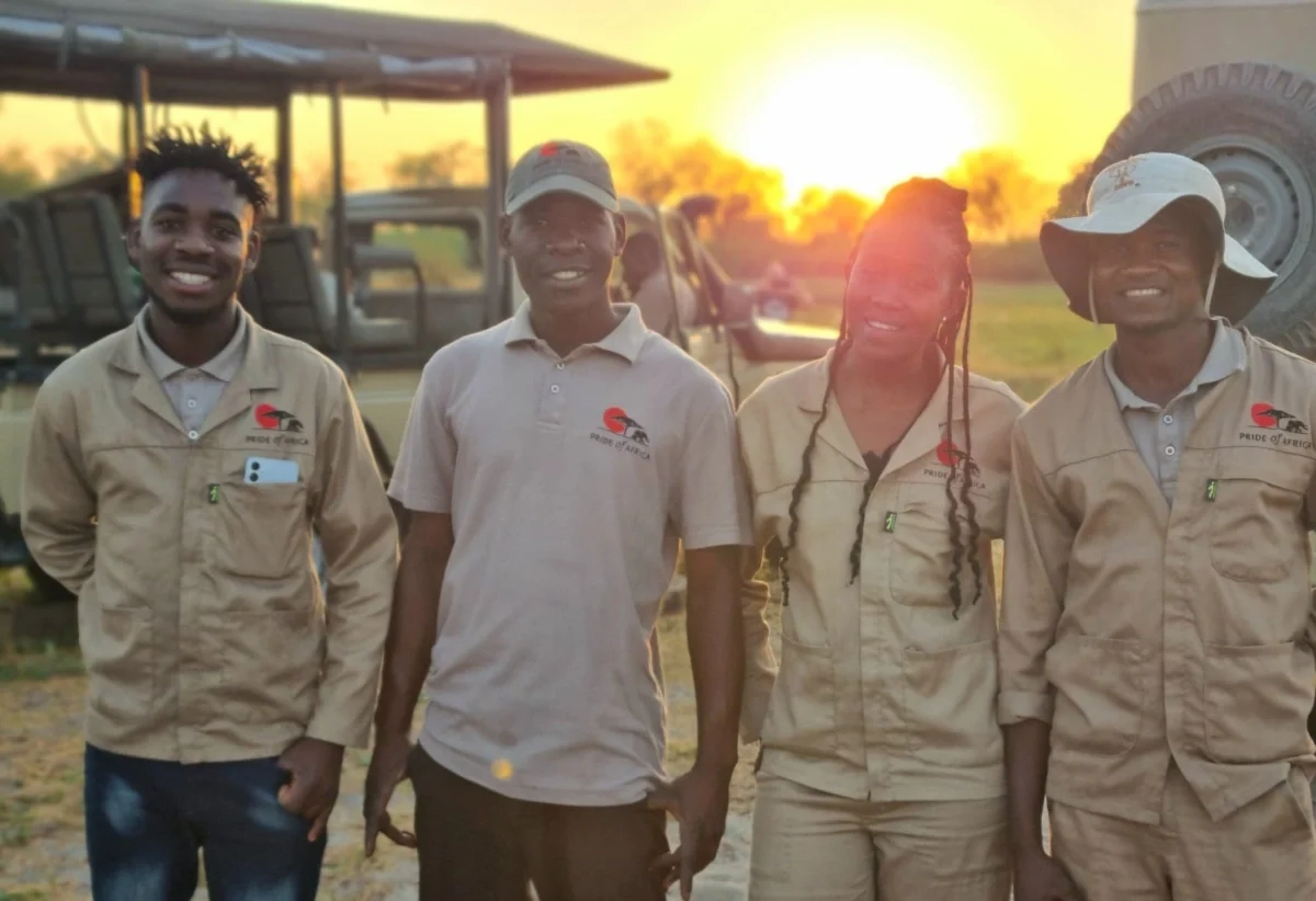 safari-guides-pose-at-sunset