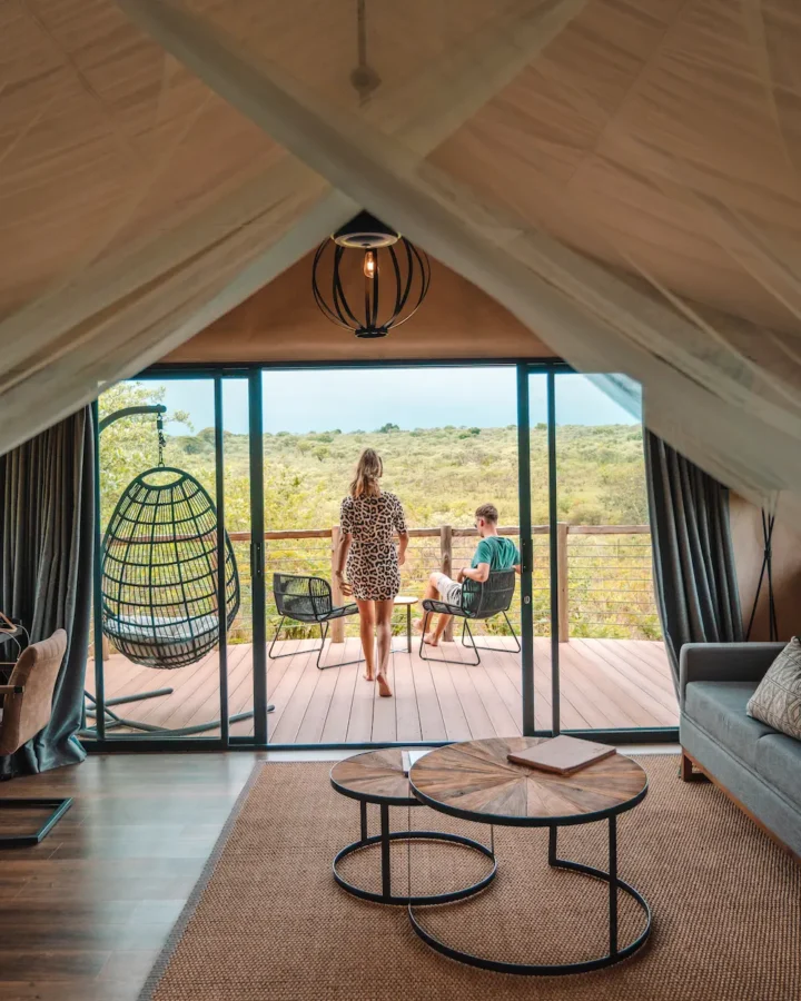 inside of luxury tent with 2 people on the patio