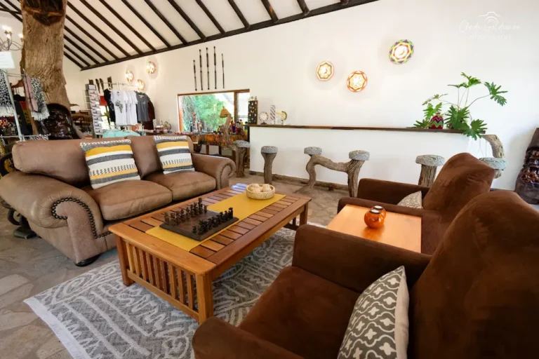 lounge area at a lodge in the kruger with couches and a table