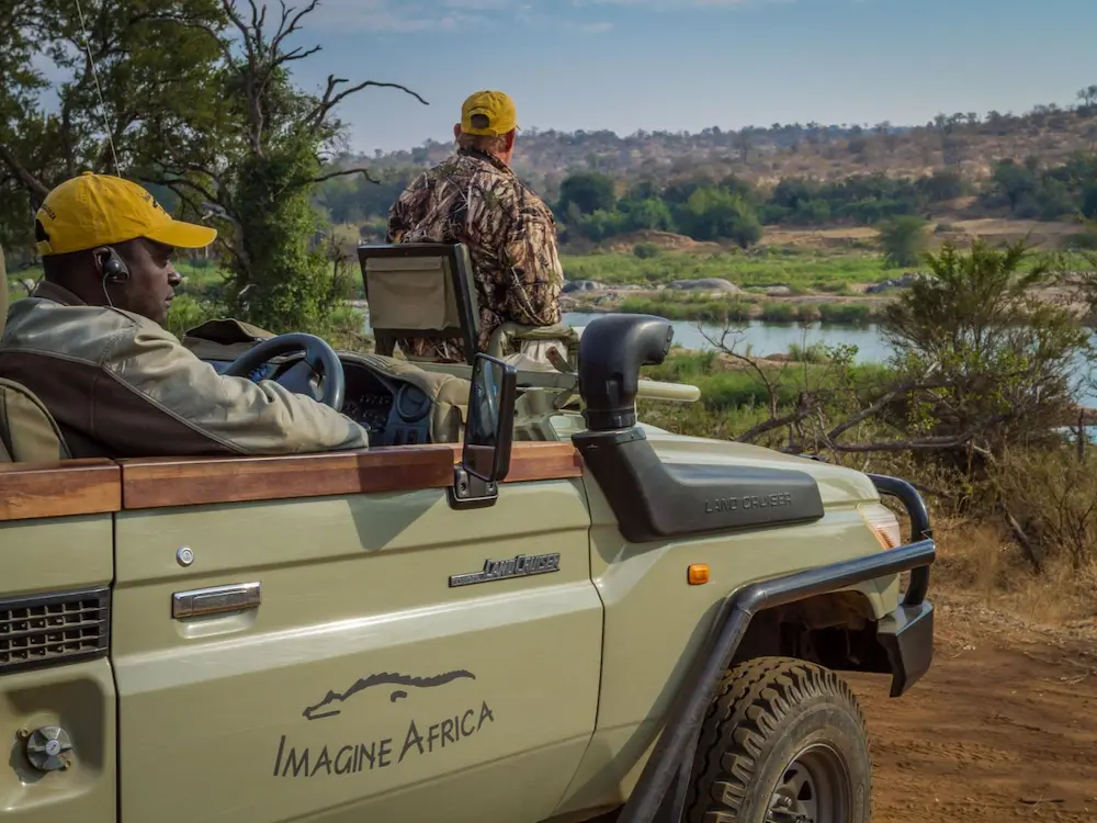 side view of an open top safari 4x4 vehicle