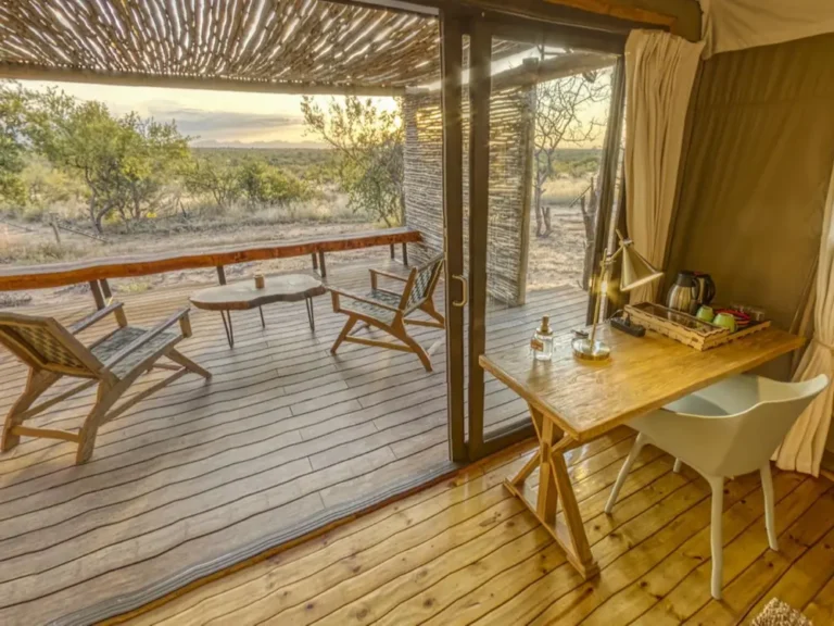 view of a desk and chair with the veranda and furniture iutside