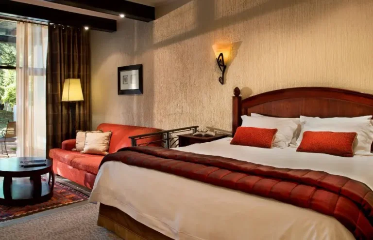 room in a lodge with a king bed, sofa and coffee table
