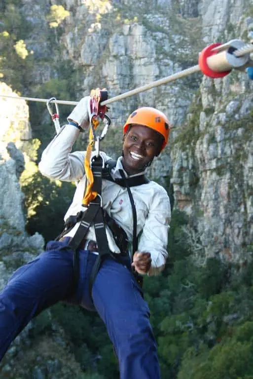 Man laughs on zipline at Elgin cape Canopy Tour